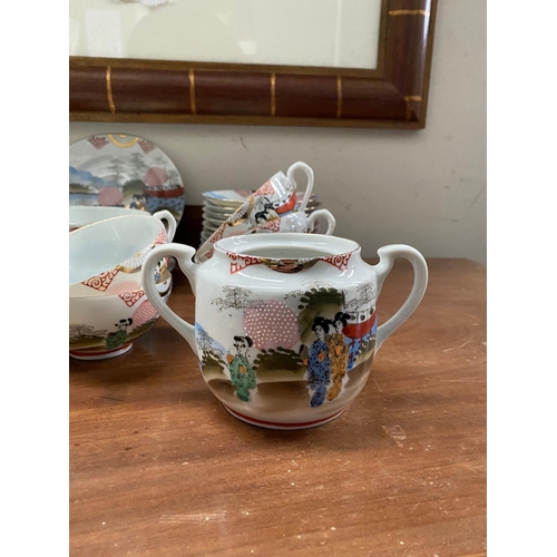 128 - A FINE VINTAGE JAPANESE HAND-PAINTED TEA SERVICE, to include 11 cups, 11 saucers, 12 side plates, 2 ... 