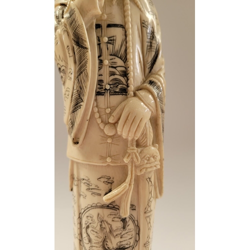 138 - A PAIR OF CARVED CHINESE FIGURES IN THE FORM OF AN EMPEROR & EMPRESS, each with etched design to the... 