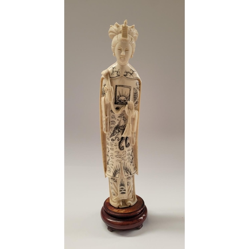 138 - A PAIR OF CARVED CHINESE FIGURES IN THE FORM OF AN EMPEROR & EMPRESS, each with etched design to the... 