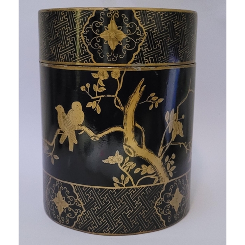 141 - A TALL CYLINDRICAL CHINESE LAQUERED LIDDED BOX, the box decorated all over with gilt coloured birds ... 