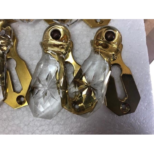 159 - A SET OF 12 GLASS & BRASS ESCUTCHEON COVERS (keyhole covers), all in very good condition.