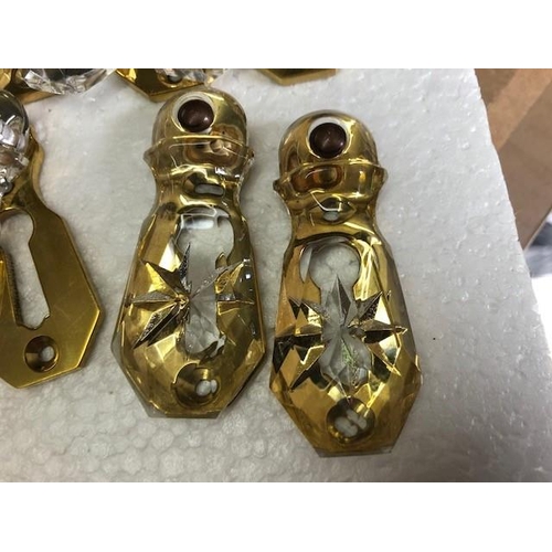 159 - A SET OF 12 GLASS & BRASS ESCUTCHEON COVERS (keyhole covers), all in very good condition.