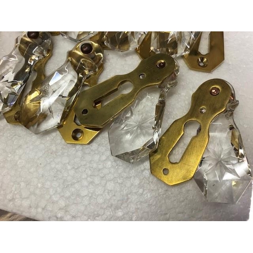 159 - A SET OF 12 GLASS & BRASS ESCUTCHEON COVERS (keyhole covers), all in very good condition.