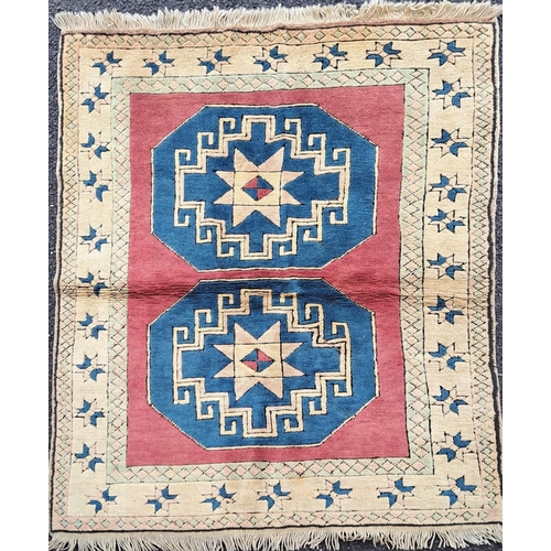 169 - A TRADITIONAL TURKISH ‘KARS’ FLOOR RUG, with double medallion design to the centre, having main grou... 