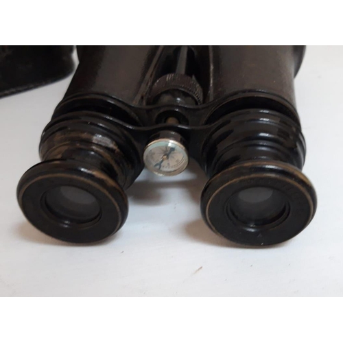 174 - A CASED FRENCH BINOCULARS, in leather case with integrated compass, circa 1900. Stamped Sans Rivale,... 