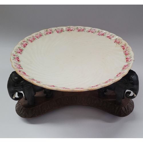 181 - A 19TH CENTURY CARVED ELEPHANT PLATE / BOWL STAND, COMPRISING OF THREE HANDCARVED EBONISED WOODEN EL... 