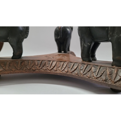 181 - A 19TH CENTURY CARVED ELEPHANT PLATE / BOWL STAND, COMPRISING OF THREE HANDCARVED EBONISED WOODEN EL... 