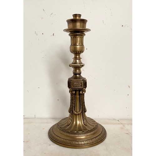 184 - A LARGE ANTIQUE GILT CANDLE HOLDER, ornately decorated support with column design as well as embosse... 