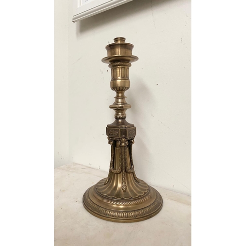 184 - A LARGE ANTIQUE GILT CANDLE HOLDER, ornately decorated support with column design as well as embosse... 