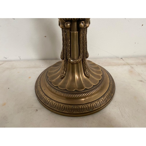 184 - A LARGE ANTIQUE GILT CANDLE HOLDER, ornately decorated support with column design as well as embosse... 