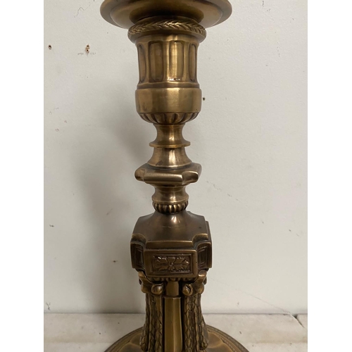 184 - A LARGE ANTIQUE GILT CANDLE HOLDER, ornately decorated support with column design as well as embosse... 