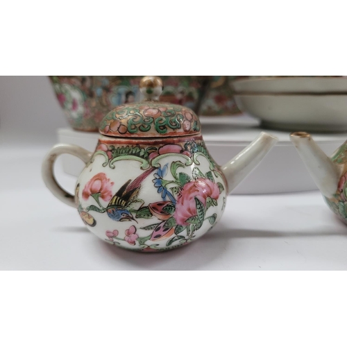 190 - A COLLECTION OF FAMILLE ROSE PORCELAIN ITEMS, includes; two coffee cups with matching saucers, a lid... 