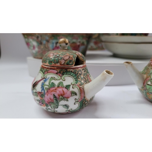 190 - A COLLECTION OF FAMILLE ROSE PORCELAIN ITEMS, includes; two coffee cups with matching saucers, a lid... 