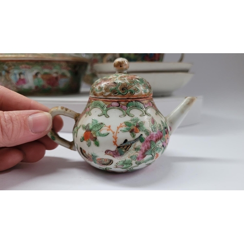 190 - A COLLECTION OF FAMILLE ROSE PORCELAIN ITEMS, includes; two coffee cups with matching saucers, a lid... 