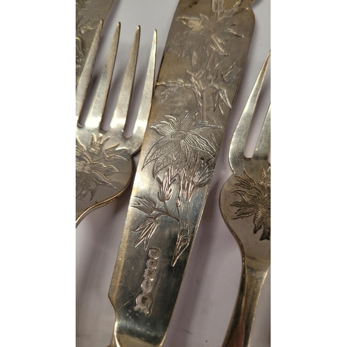 194 - A VERY GOOD LATE 19TH CENTURY SILVER PLATE SET OF FISH KNIVES & FORKS, each decorated with an engrav... 