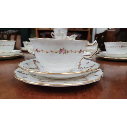 197 - A PARTIAL CRESCENT & SONS BEST BURNISHED GOLD ENGLISH TEA SET, with floral bowl decoration; includes... 