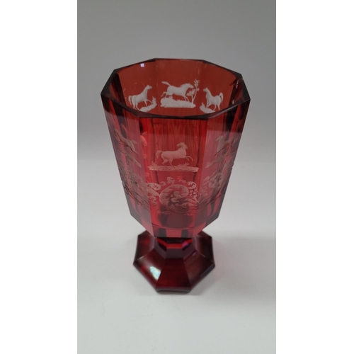 200 - A LARGE OCTAGONAL SHAPED INTAGLIO ETCH RED BOHEMIAN GLASS / VASE, decorated with acid etched horse d... 