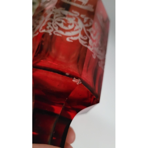 200 - A LARGE OCTAGONAL SHAPED INTAGLIO ETCH RED BOHEMIAN GLASS / VASE, decorated with acid etched horse d... 