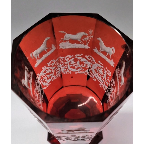 200 - A LARGE OCTAGONAL SHAPED INTAGLIO ETCH RED BOHEMIAN GLASS / VASE, decorated with acid etched horse d... 