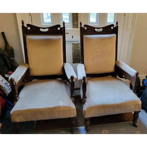 219 - A GOOD QUALITY PAIR OF LATE 19TH / EARLY 20TH CENTURY DEEP SEATED ARMCHAIRS, each with a curved cres... 