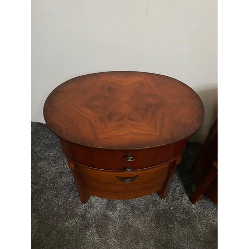 225 - A PAIR OF OVAL SHAPED WALNUT LOCKERS / CABINETS, each with two drawers, the tops with striking book-... 