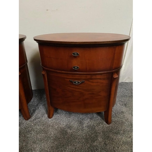 225 - A PAIR OF OVAL SHAPED WALNUT LOCKERS / CABINETS, each with two drawers, the tops with striking book-... 