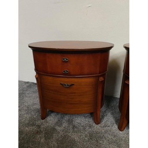 225 - A PAIR OF OVAL SHAPED WALNUT LOCKERS / CABINETS, each with two drawers, the tops with striking book-... 