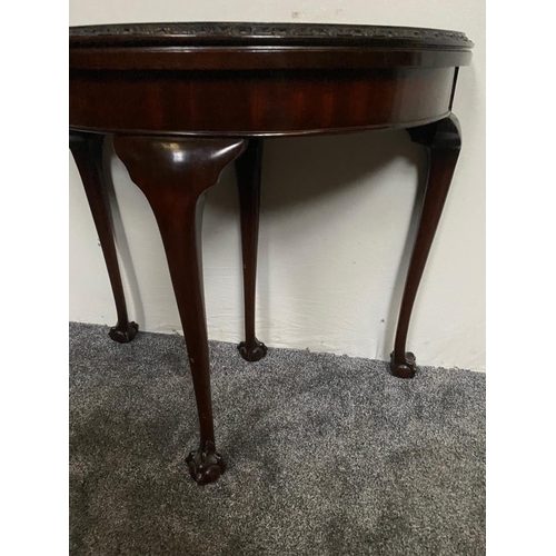 227 - A GOOD QUALITY DEMI-LUNE SHAPED MAHOGANY FOLD OVER CARD TABLE, with carved foliage detail to the fro... 