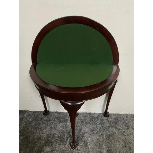 227 - A GOOD QUALITY DEMI-LUNE SHAPED MAHOGANY FOLD OVER CARD TABLE, with carved foliage detail to the fro... 