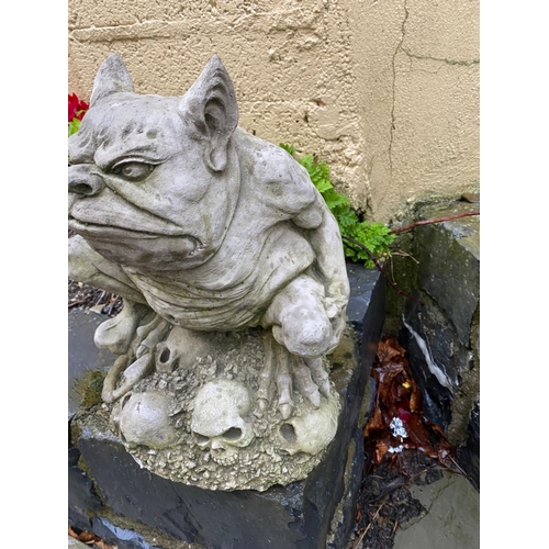 230 - A SMALL GARDEN ORNAMENT IN THE FORM OF A GARGOYLE, 34cm tall.