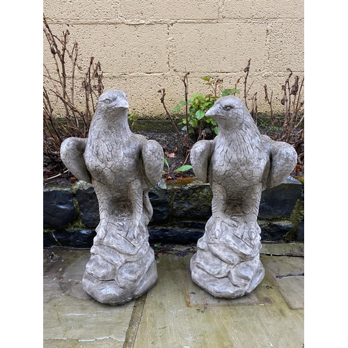 233 - A PAIR OF GARDEN ORNAMENTS OR PIER TOPPERS IN THE FORM OF EAGLES, 59cm tall each.