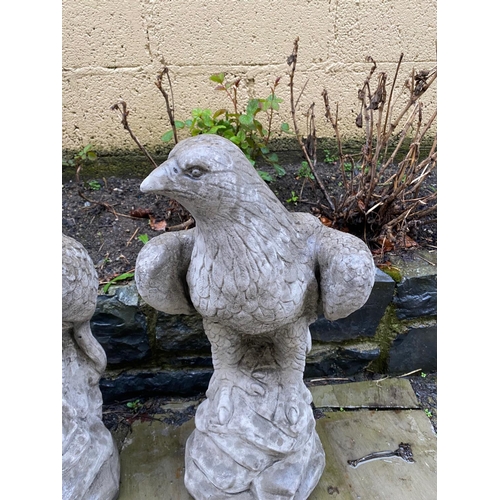 233 - A PAIR OF GARDEN ORNAMENTS OR PIER TOPPERS IN THE FORM OF EAGLES, 59cm tall each.