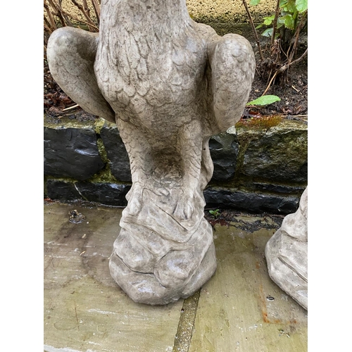 233 - A PAIR OF GARDEN ORNAMENTS OR PIER TOPPERS IN THE FORM OF EAGLES, 59cm tall each.