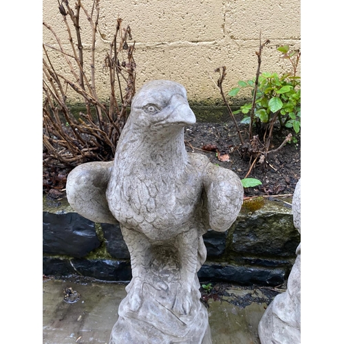 233 - A PAIR OF GARDEN ORNAMENTS OR PIER TOPPERS IN THE FORM OF EAGLES, 59cm tall each.