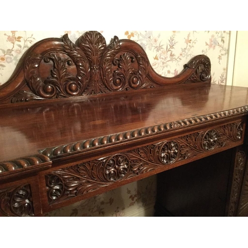 245 - A FANTASTIC ANGLO-INDIAN HAND CARVED MAHOGANY SIDEBOARD, with raised serpentine shaped back gallery ... 