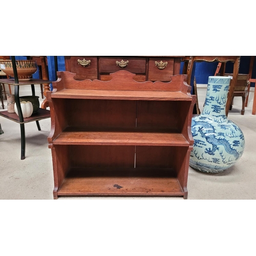 25 - A SCOTTISH ARTS & CRAFTS CARVED OAK THREE TIER SHELF, with beautifully carved side panels showing th... 