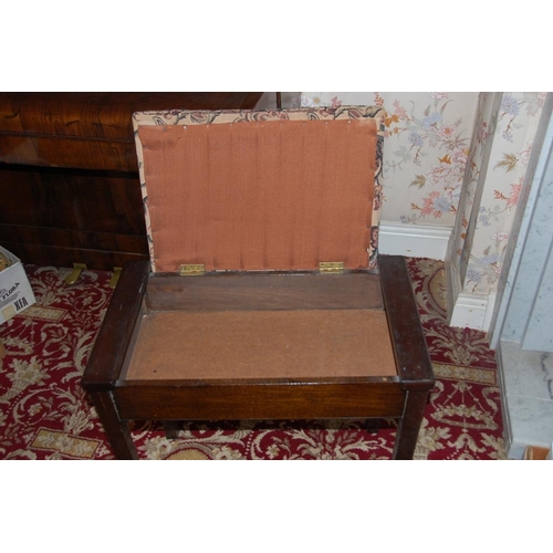 251 - A VINTAGE PIANO STOOL WITH CUSHIONED SEAT & RAISED ON SQUARE LEG – the top with hinged lid – opens t... 