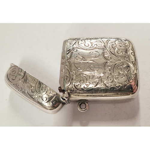 26 - A LATE 19TH CENTURY SILVER VESTA CASE, beautifully engraved with scrolling foliage design to the fro... 