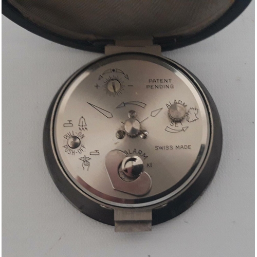 28 - A RARE VINTAGE SWIZA SHEFFIELD POCKET TRAVEL WATCH, circa 1960s, Swiss Made, the case opens to hold ... 