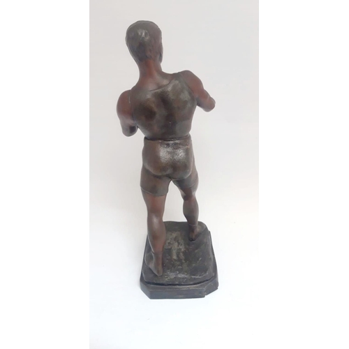 35 - AN EARLY 20TH CENTURY FIGURE OF A BOXER, artist signature impressed to the base; Georg Vacossin. Dim... 