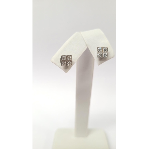 36 - A GEORGEOUS CASED PAIR OF CARTIER DIAMOND CLUSTER STUD EARRINGS, each with four brilliant cut diamon... 