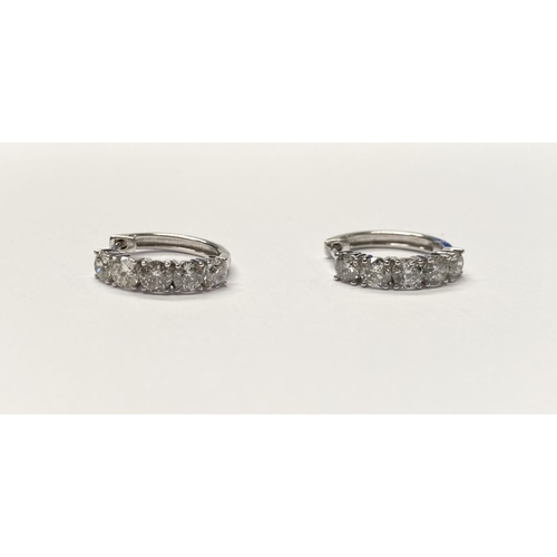 38 - A PAIR OF FINEROCK 14CT WHITE GOLD DIAMOND HOOP EARRINGS, each with five round cut diamonds in 14ct ... 