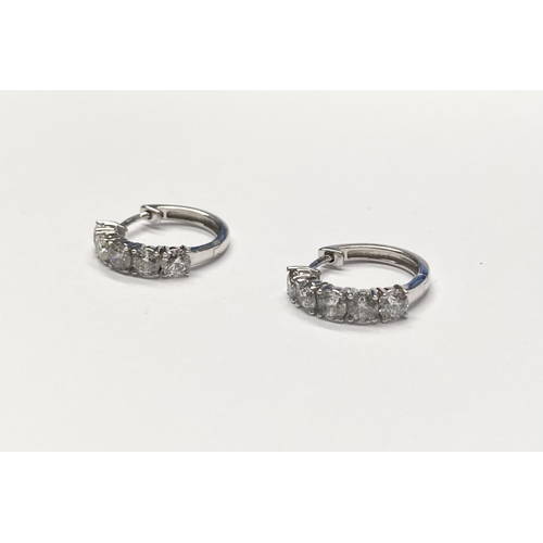 38 - A PAIR OF FINEROCK 14CT WHITE GOLD DIAMOND HOOP EARRINGS, each with five round cut diamonds in 14ct ... 