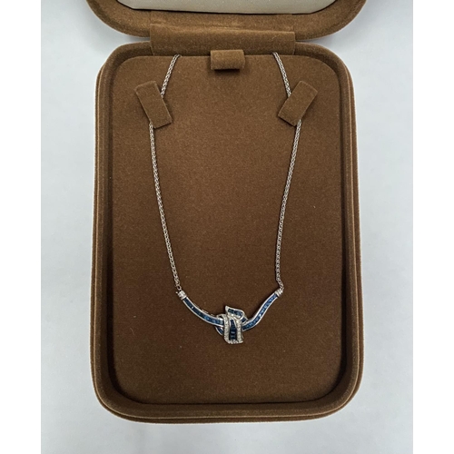 4 - AN EXQUISITE 14CT WHITE GOLD DIAMOND AND SAPPHIRE ACCENT NECKLACE, featuring five channel set sapphi... 