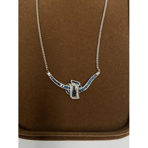 4 - AN EXQUISITE 14CT WHITE GOLD DIAMOND AND SAPPHIRE ACCENT NECKLACE, featuring five channel set sapphi... 