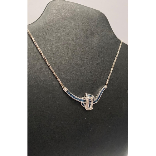 4 - AN EXQUISITE 14CT WHITE GOLD DIAMOND AND SAPPHIRE ACCENT NECKLACE, featuring five channel set sapphi... 