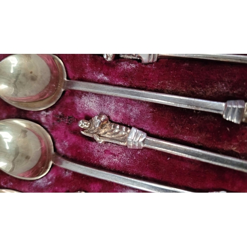 40 - A LATE 19TH CENTURY CASED SET OF 12 SILVER MONK TEA SPOONS WITH SUGAR TONGS, each spoon with a monk ... 