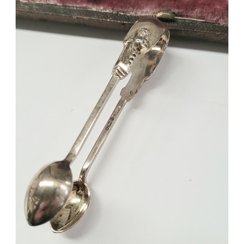 40 - A LATE 19TH CENTURY CASED SET OF 12 SILVER MONK TEA SPOONS WITH SUGAR TONGS, each spoon with a monk ... 