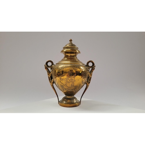 42 - A COLLECTION OF INIDAN BRASS ONAMENTS, including an urn shaped ornament engraved with figural design... 