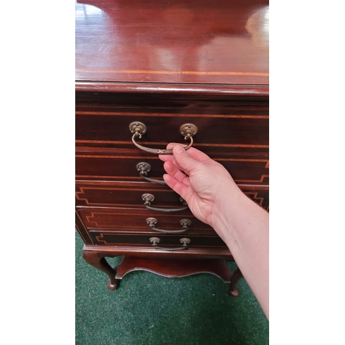 44 - AN EDWARDIAN MAHOGANY & SATINWOOD INLAID MUSIC CABINET, with 5 drop front drawers each with a swing ... 